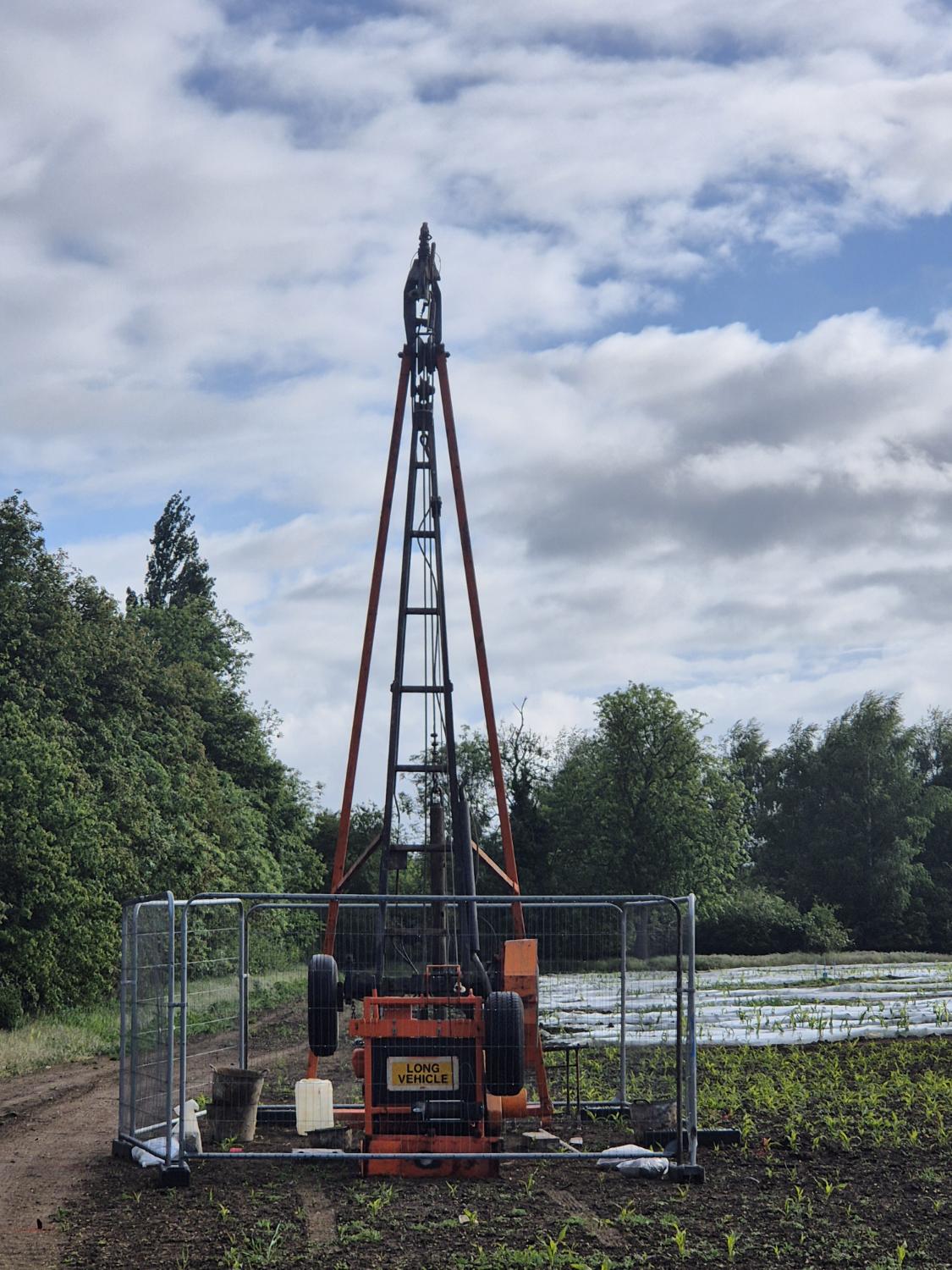 Cable percussion rig set up in a field